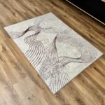 Soft, modern beige-brown rug